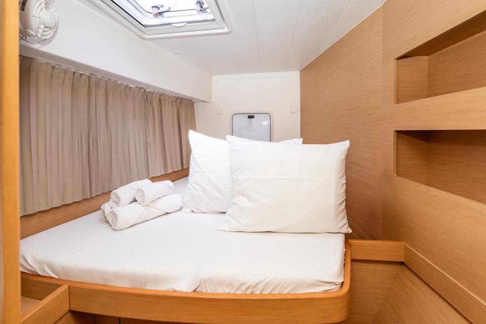 Forward double cabin with storage and reading lights