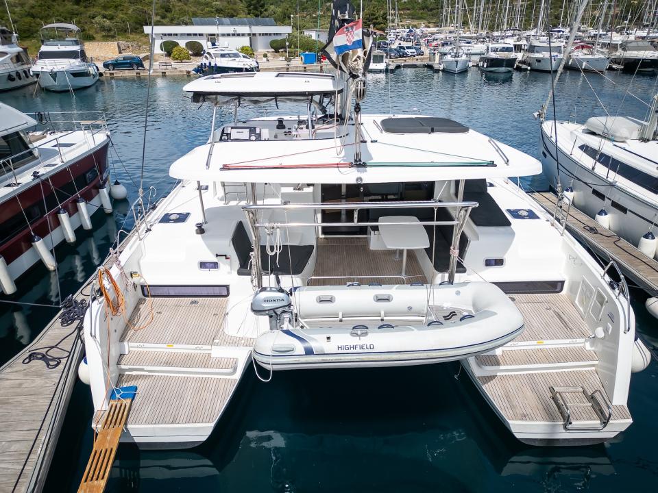 Bows and trampolines of the catamaran seen from the pontoon