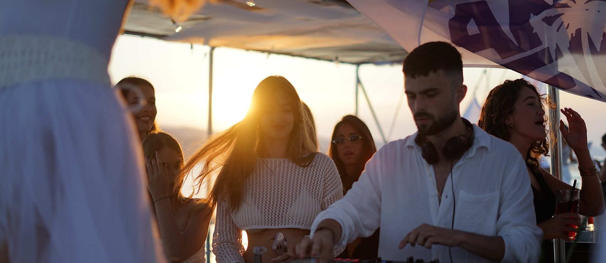 Guests together on deck at golden hour
